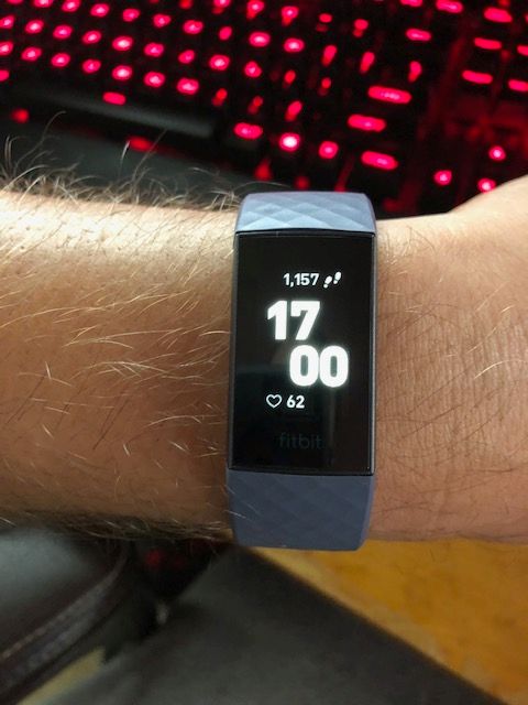 A Fitbit Charge 3 fitness tracker on a wrist