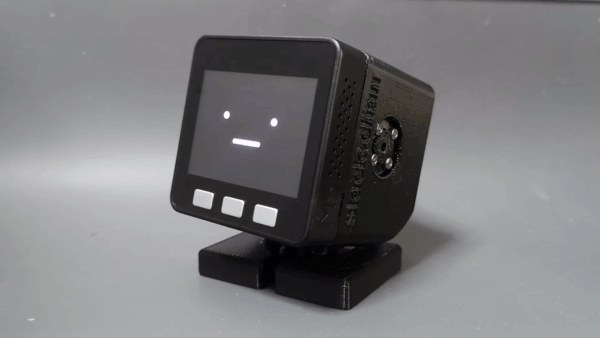Stack-chan, a palm-sized robot with a small face on its screen